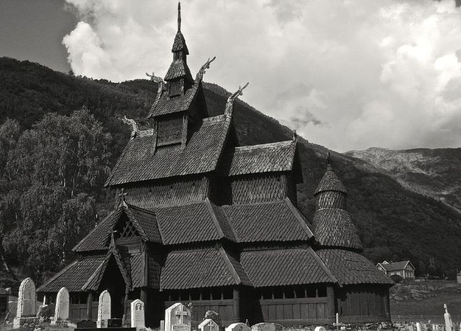 Black and white photo of a Norwegian stave church. 