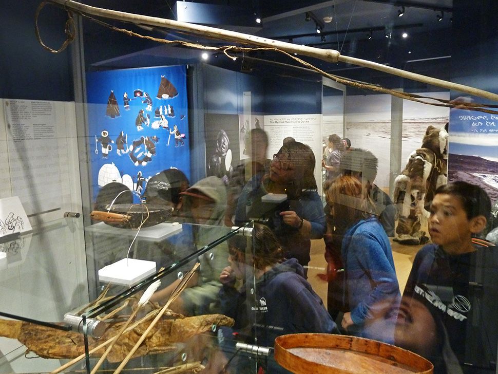 Students from Quqshuun Ilihakvik studying the Gjoa Haven/ Amundsen objects at the Nattilik Heritage Centre in Gjoa Haven October 2014