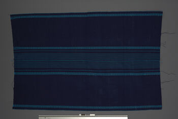 (UEM46846) Woven using a loin loom, warp faced weave with pick-up pattern edging. Woven in two lengths and sewn together in the middle. Used by women for everyday use, parties and rituals. It is fastened with a wamkok belt that is tied around the waist. Material: Acryl.
