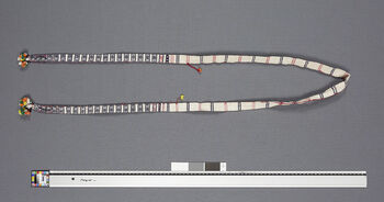 (UEM46853). A wamkok is tied around the waist over a pini to keep it in place. Pattern name: Phongrong angsu , meaning a seed capsule with thorns, thorn apple. Material: Cotton.