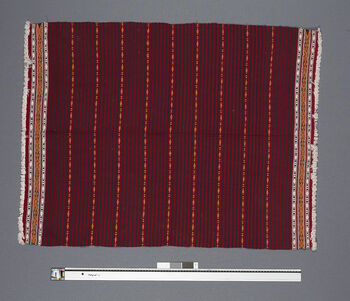 ( UEM 46858) Originally woven on a loin loom, now mainly using a floor loom. Weft faced weave.