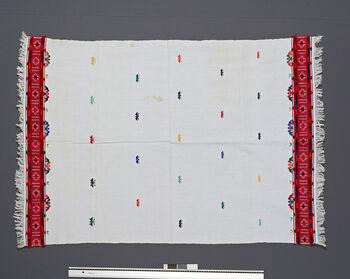 ( UEM 46863) Floor loom, plain weave, pick-up pattern. Material: Cotton, acrylic yarn pattern.