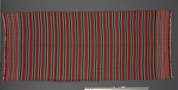 ( UEM 46867) Floor loom, double shank, weft faced weave, can also be woven using a loin loom. Can be used as a shawl or draped as a pehseleng in several ways. Used at weddings, festivals and also for everyday use. Mostly used by elderly women from 1990 to 2020. Material: Cotton.
