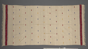 (UEM46871) Floor loom, plain weave, pick-up patterns. Eri silk and motifs in acrylic. Draped and used as pehseleng and khonjari .