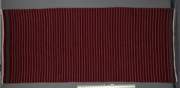 (UEM46876) Floor loom, plain weft faced weave. Used as shawl on cold days but can be draped as a pehseleng as well. Material: cotton (warp), cashmilon acryl (weft). Diphu district.
