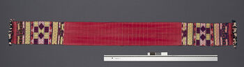 (UEM46887) Loin loom, pick-up motifs. Plain weave. Used by married men. Material: Cotton, motifs in acrylic. District: Hamren. 