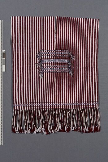 (UEM46891) Loin loom, warp faced weave with kirip middle front and smaller middle back. Used by married men, often the village elders.  Material:  Acryl. District: Baithalangso, West Karbi Anglong.