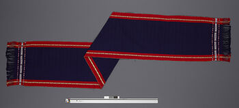 (UEM46901) Loin loom, warp faced weave. Kirip horizontal and pick-up patterns on the warp (yellow). Name of patterns: Wosu ame (bird’s eye). This is said to be a very old, original type of piba - jir-ik.  In the 1990's, this type was mostly woven in Hamren and surrounding areas. Woven at Bhaitalangso. Material: Thailand yarn.