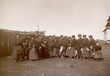 (UEMf09893_007) Monks outside the Buddhist monastery Gandantegchenlin on the day of the New Year celebration on February 7 1913. According to Krisztina Teleki and Zsuzsa Majer (and also Mamen), laypeople such as Mamen could only access the complex one day each summer, however, Mamen was let in in February and captured this photograph, again testifying to his photographic access.
