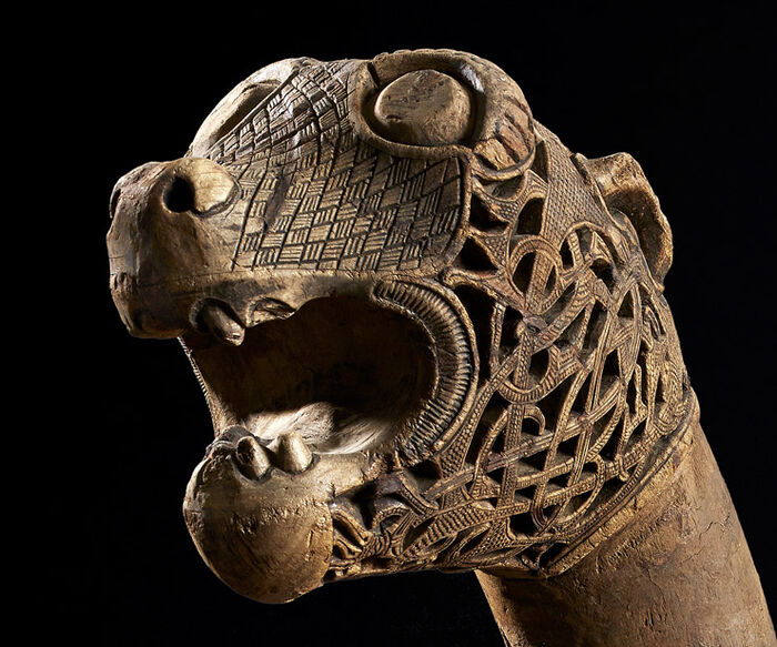 Snake head carved from wood.