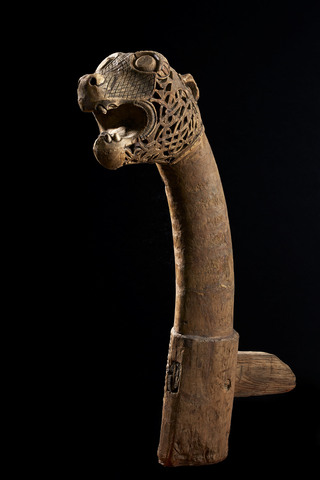 A wooden carved snake head