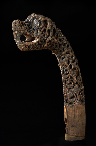 A wooden carved snake head