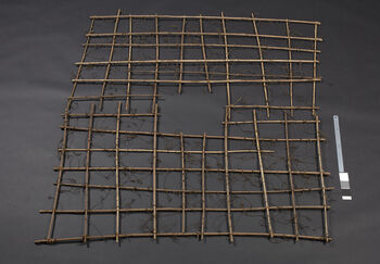 (UEM12194) Rev. Bodding’s notes: 'The procedure is as with 12187-12189. The cave with the lure is placed in the hole located in the middle of the sprinklers laid out on the ground.' Material: Wood. Height: 141 cm, width: 133 cm.