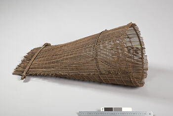 (UEM12208)&amp;#160;Rev. Bodding’s notes: 'These fish traps are used mainly at the end of the rainy season when quite a lot of fish are found in the rice fields and in the small streams. Where the water trickles one dam up on both sides, so that an opening is left big enough for the fish trap to be placed. The water runs through the trap, and the fish remains in this. The traps are set in the evening and looked after in the morning.'