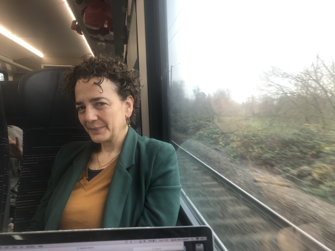 Woman sitting on a train.