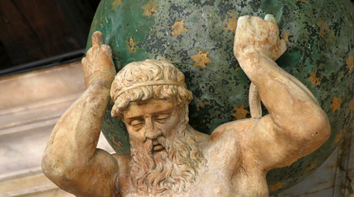Statue of a man holding the Earth on his shoulders