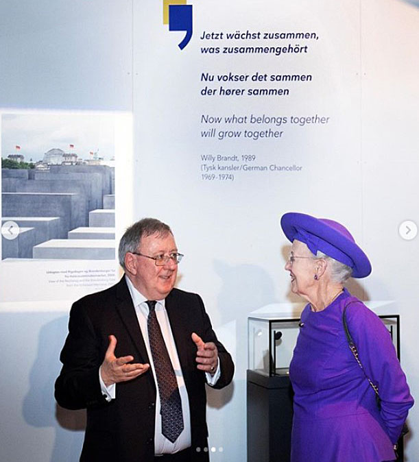 A man talking with the Queen of Denmark
